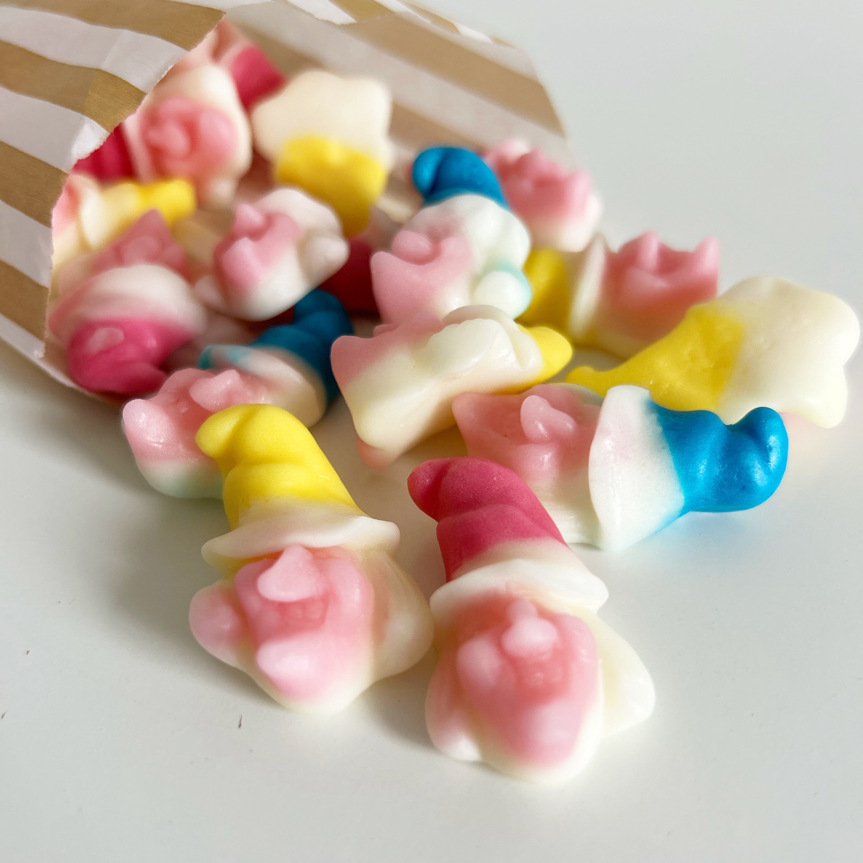 Colorful gummy candies on a white surface